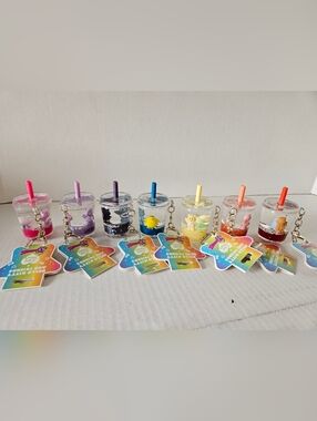 Set Of 7 CARE BEAR AND HELLO KITTY  Keychains.